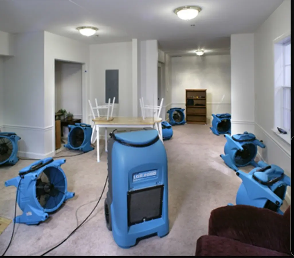 Air movers and dehumidifier setup for Water Damage Restoration in East Camden